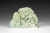 A Chinese carved jade figural group of trees and birds