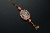 A Chinese red porcelain pendant