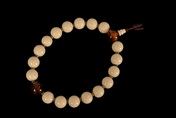 A STRAND OF IVORY PRAYER BEADS