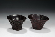 A PAIR OF CARVED ZITAN LIBATION CUPS