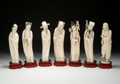 A GROUP OF SEVEN IVORY CARVED STATUES OF IMMORTALS