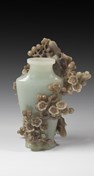 AN INTRICATELY CARVED JADE BOTTLE