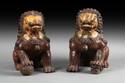 A PAIR OF CAST IRON AND ENAMELED LIONS