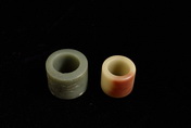 A GROUP OF TWO JADE THUMB RINGS