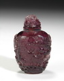 A PURPLE COLOR CARVED GLASS SNUFF BOTTLE