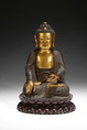 A GILT BRONZE SIDDHARTHA GAUTAMA BUDDHA