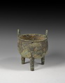AN ARCHAIC BRONZE RITUAL TRIPOD FOOD VESSEL (DING)