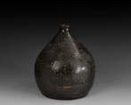A BLACK GLAZED BOTTLE VASE
