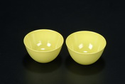 A PAIR OF LEMON YELLOW GLAZED WINE CUPS