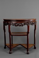 A ROSEWOOD SEMI-CIRCULAR TABLE