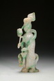 A JADEITE CARVED DEITY FIGURE