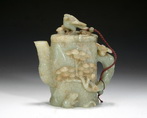 A CELADON JADE CARVED TEAPOT
