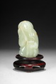 A CARVED JADE ELDER FIGURE
