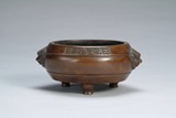 A Chinese bronze tripod censer