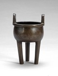 A Chinese bronze tripod censer