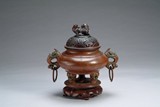A Japanese bronze tripod censer