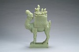 A Chinese carved jade camel figure