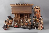 A set of twelve Japanese Ningyo dolls with accompanying wood shrine