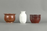 A group of three ceramic jars