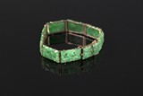 A jadeite bracelet with 14k yellow gold