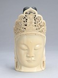 A Chinese carved ivory Buddha head statue