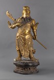 A gold lacquer bronze Guanyu statue