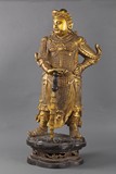 A large and finely gold lacquer bronze Skanda figure