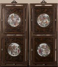 A pair of wood frames inset with porcelain plaques