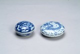Two blue and white lided jar