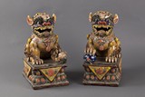 Two glazed ceramic lions