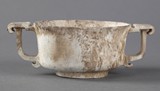 An archaic chicken bone jade cup