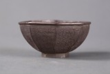 A carved silver bowl