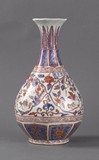 An iron red on blue and white vase
