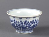 A blue and white small cup