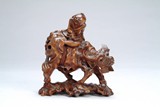 A Chinese carved wood boy figure