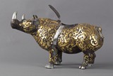 A gilt painted bronze rhinoceros figure