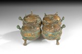 A SET OF FOUR GILT BRONZE LINKED CEREMONIAL DING VESSEL