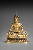 A GILT BRONZE FIGURE OF AVALOKITEŚVARA 