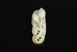 A CARVED JADE 'PEACH' ORNAMENT