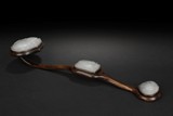 A HUANGHUALI RUYI DECORATED WITH WHITE JADE 