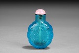 A CARVED BLUE GLASS SNUFF BOTTLE