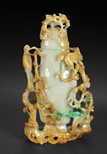 A CARVED JADEITE 'MAGPIE ON BRANCHES' VASE WITH LID 