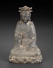 A CARVED BRONZE SEATED GUANYIN