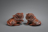 A PAIR OF BOXWOOD CARVED LION FIGURES
