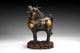 A CHINESE GILT BRONZE MYTHICAL BEAST CENSER