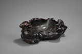 A CARVED ZITAN 'LOTUS AND CRAB' FIGURE