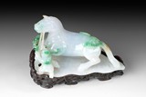 A FINELY CARVED JADEITE FIGURE OF BOY AND HORSE