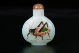 A FIVE COLOR OVERLAY WHITE GLASS SNUFF BOTTLE