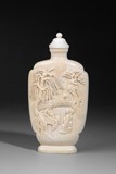 A WELL CARVED IVORY SNUFF BOTTLE