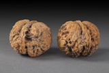 TWO ANTIQUE CARVED WALNUTS